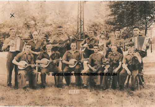 This is the the only photograph we have. John was a bandsman, he is the one on the end with the accordion. Does anyone recognise him or any of the others?